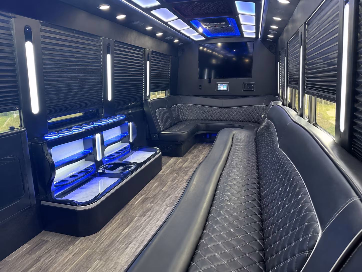 Wedding guests seated inside a party bus serving Birmingham